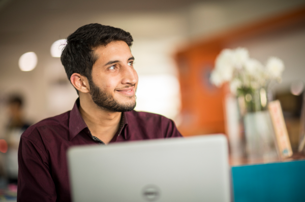 Adult male sitting at a computer 