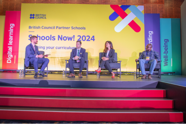 Four panelllists sitting on stage at the 2024 Partner Schools Conference