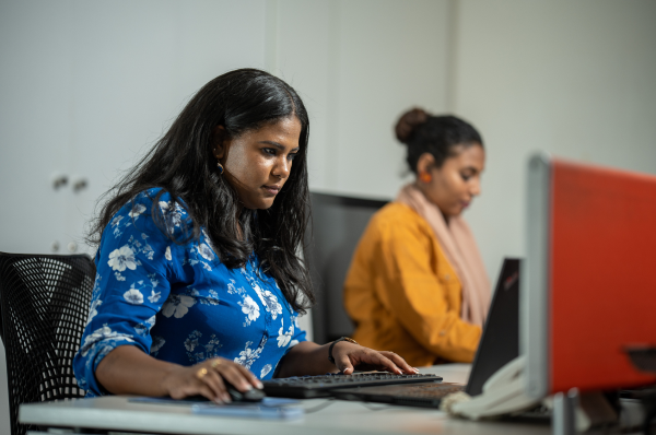 Two women working at computers