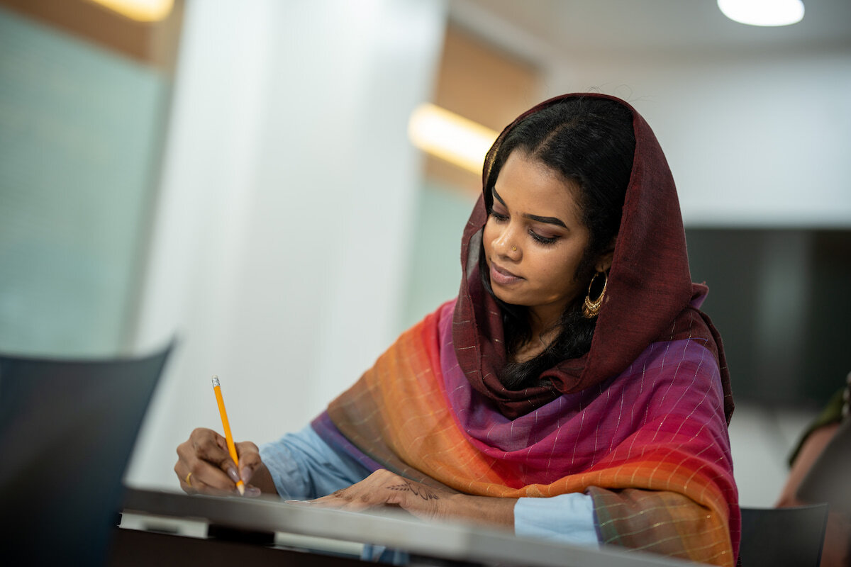 Girl writing, exam dates