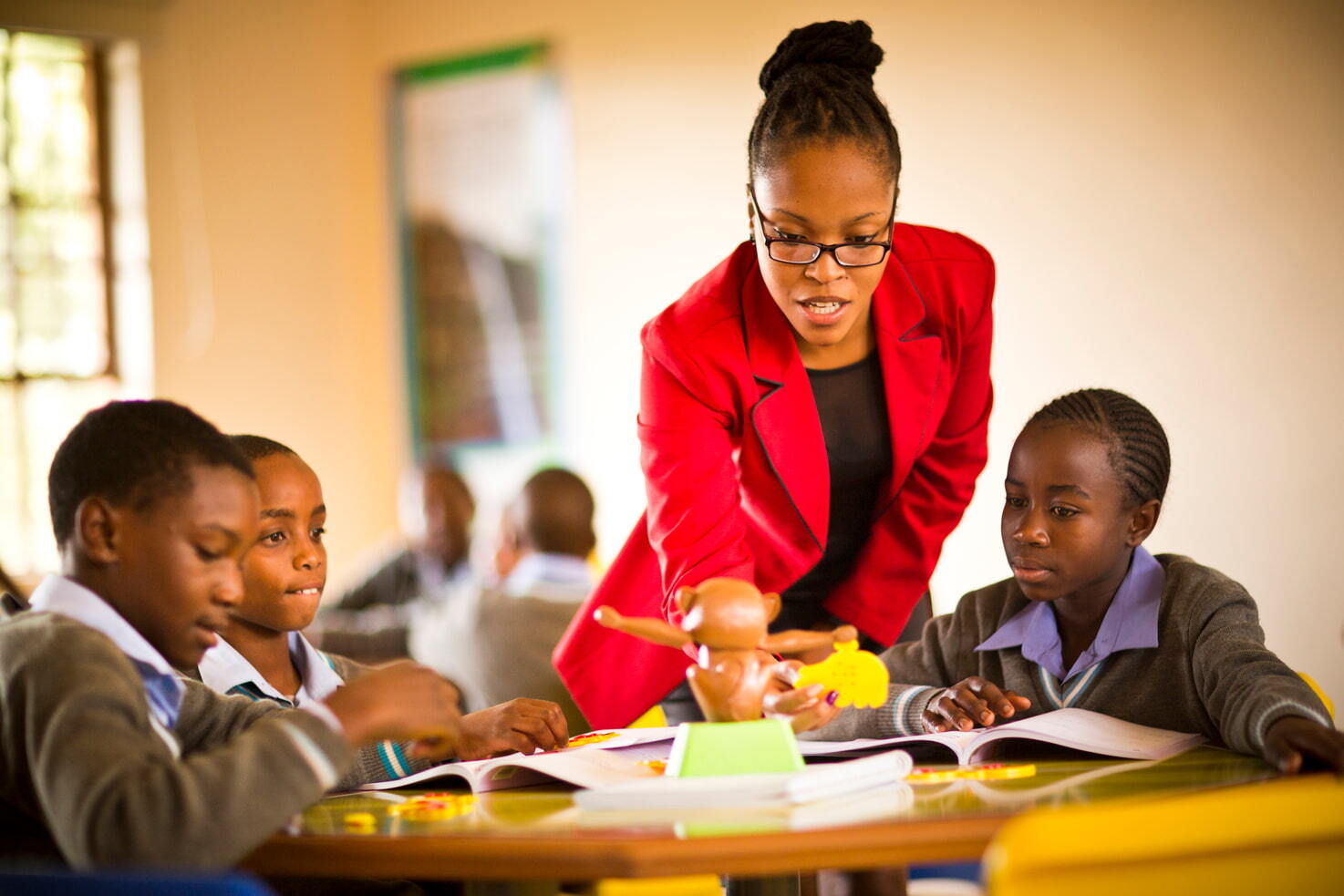Teacher in a British Council Partner School with kids